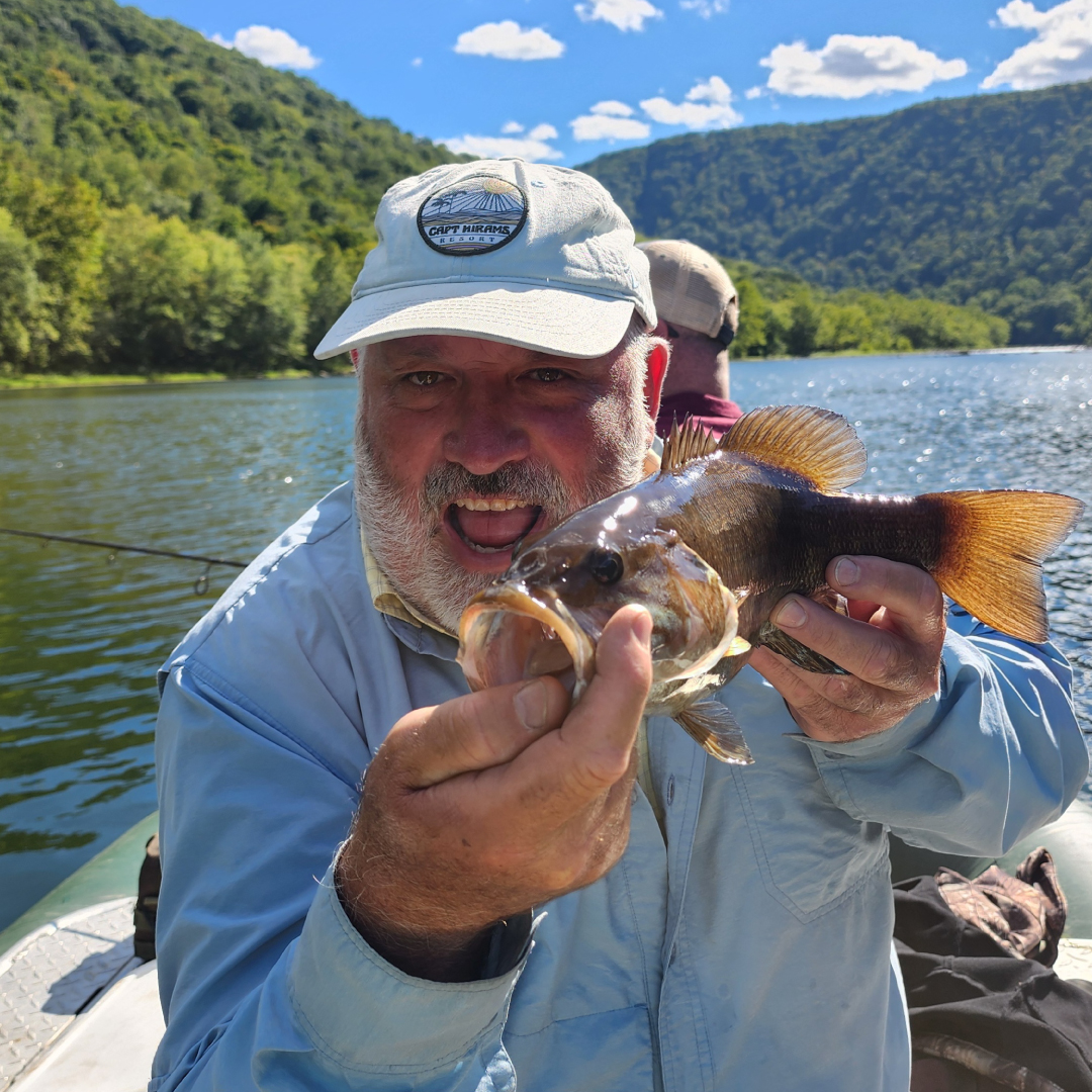 Expert Fisherman Holding A Fish