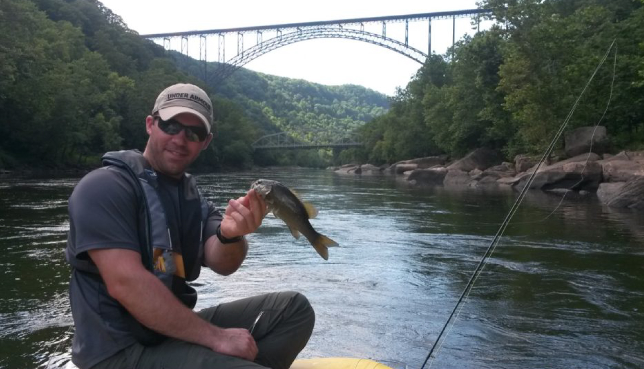 Fisherman infront of the new river gorge.