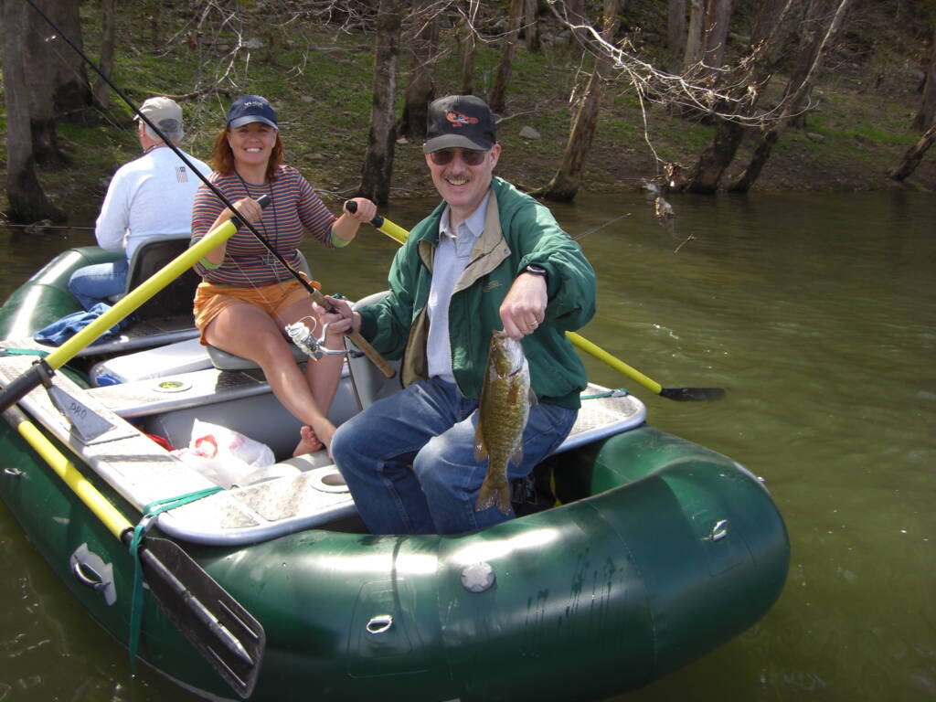 Family on a raft during a guided Fishing Trip